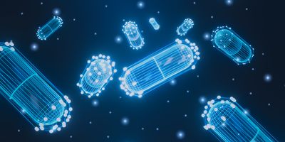 Abstract futuristic pills wireframe and capsule on glowing blue background