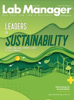 Cover of April 2023 Issue of Lab Manager. Title reads "Leaders in Sustainability". Subtitle reads "Learning from global corporate leaders in lab sustainability". Paper cut-out art shows a skyline featuring buildings, wind turbines, and trees.