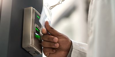 Man unlocks door to lab with keycard