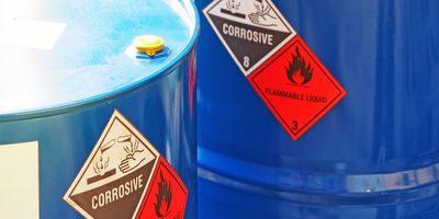 the close-up shot of blue color hazardous dangerous chemical barrels