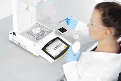 The Cubis® II balance scientist in lab doing lab weighing